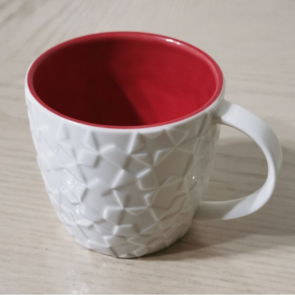 Starbucks mug. Beautifully designed with impression on surface.